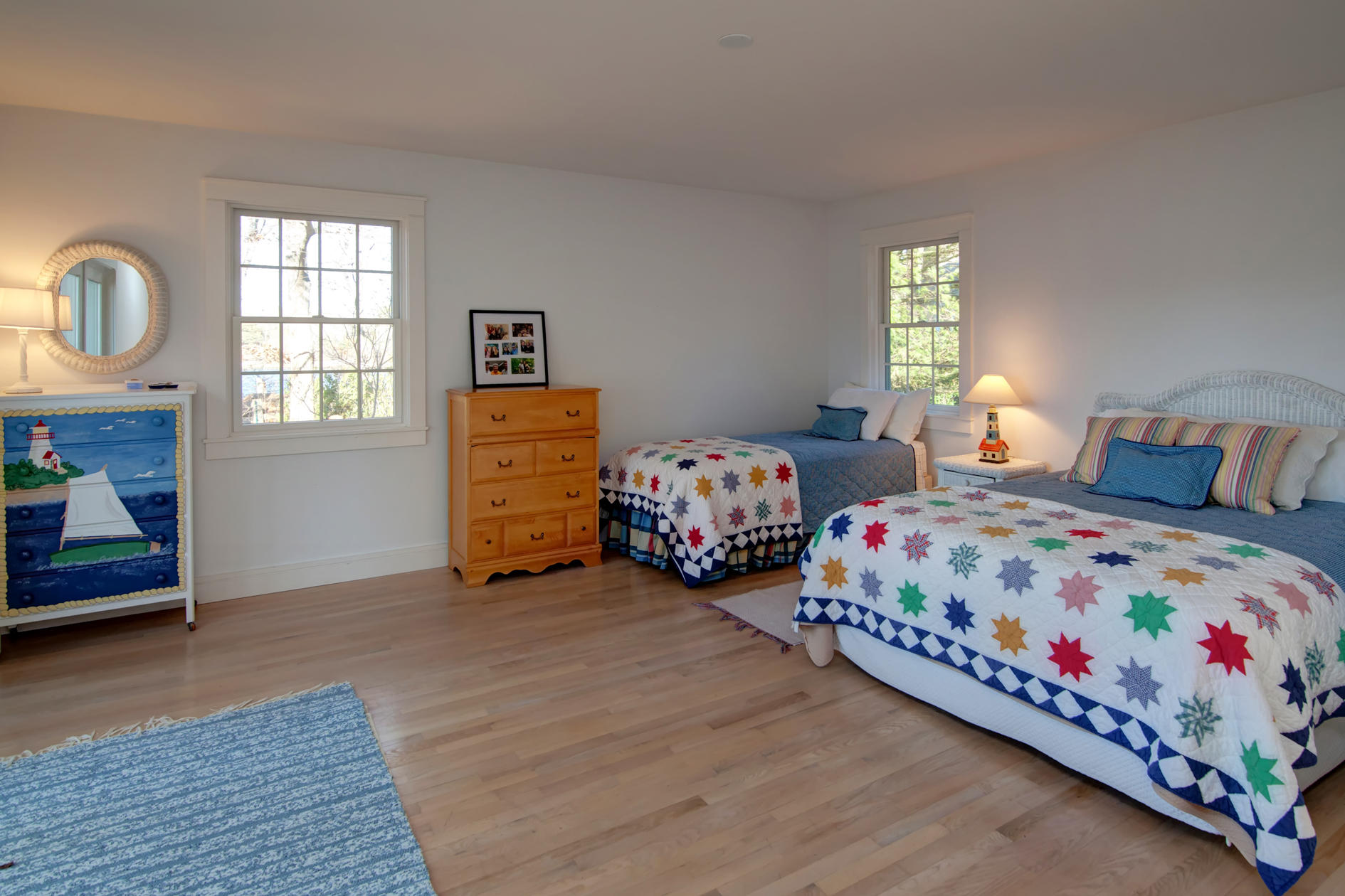 624 Poponessett Road Cotuit, MA 02635 - Photo 22 of 30 a bedroom with two beds and a window