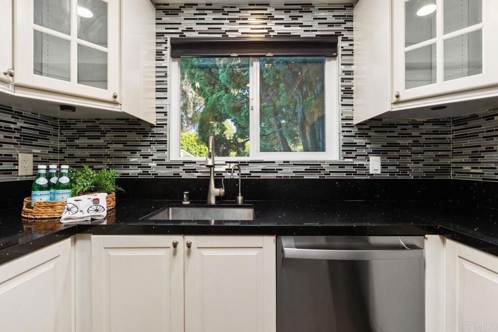 4369 Dowitcher Way Oceanside, CA 92057 - Photo 14 of 37 a kitchen with a sink and a window