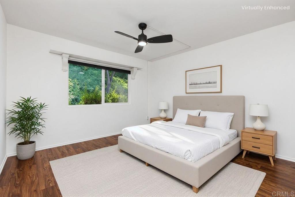 4369 Dowitcher Way Oceanside, CA 92057 - Photo 16 of 37 a bedroom with a large bed and a potted plant