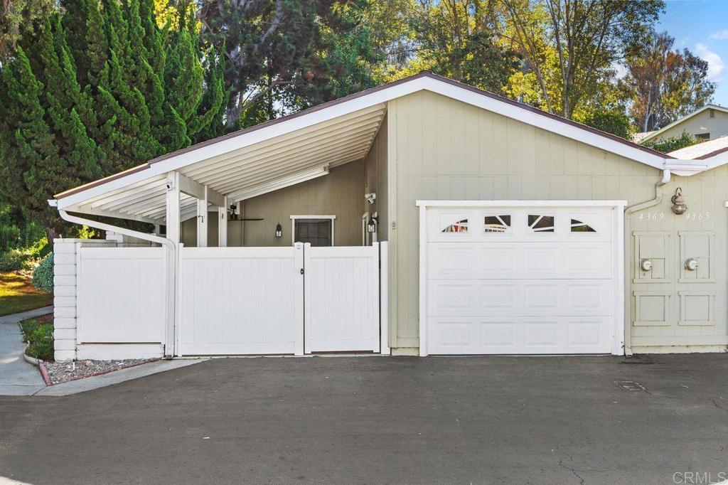 4369 Dowitcher Way Oceanside, CA 92057 - Photo 2 of 37 a front view of a house with a garage