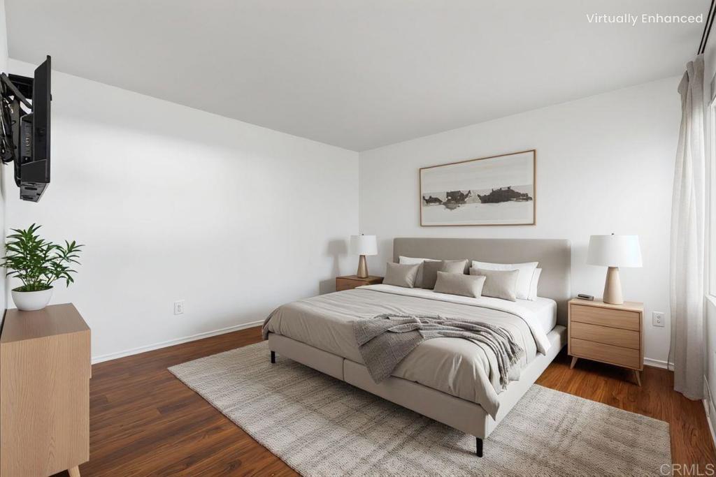 4369 Dowitcher Way Oceanside, CA 92057 - Photo 21 of 37 a bedroom with a bed and a potted plant