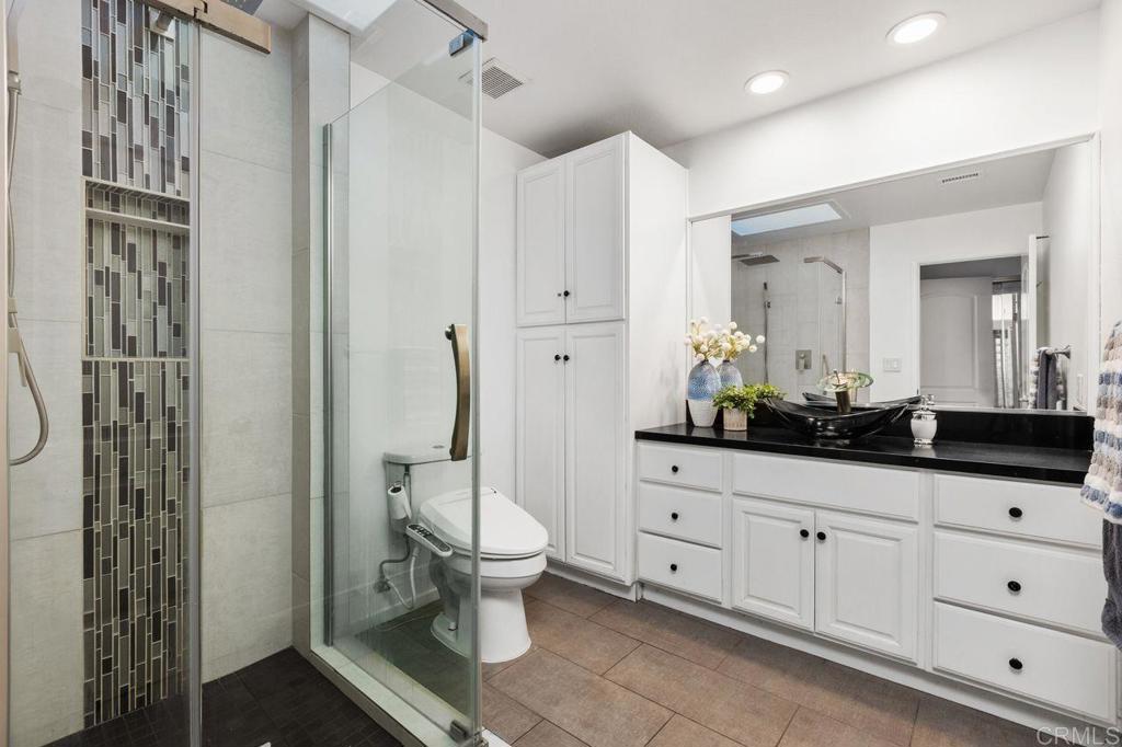 4369 Dowitcher Way Oceanside, CA 92057 - Photo 23 of 37 a spacious bathroom with double sink and a mirror