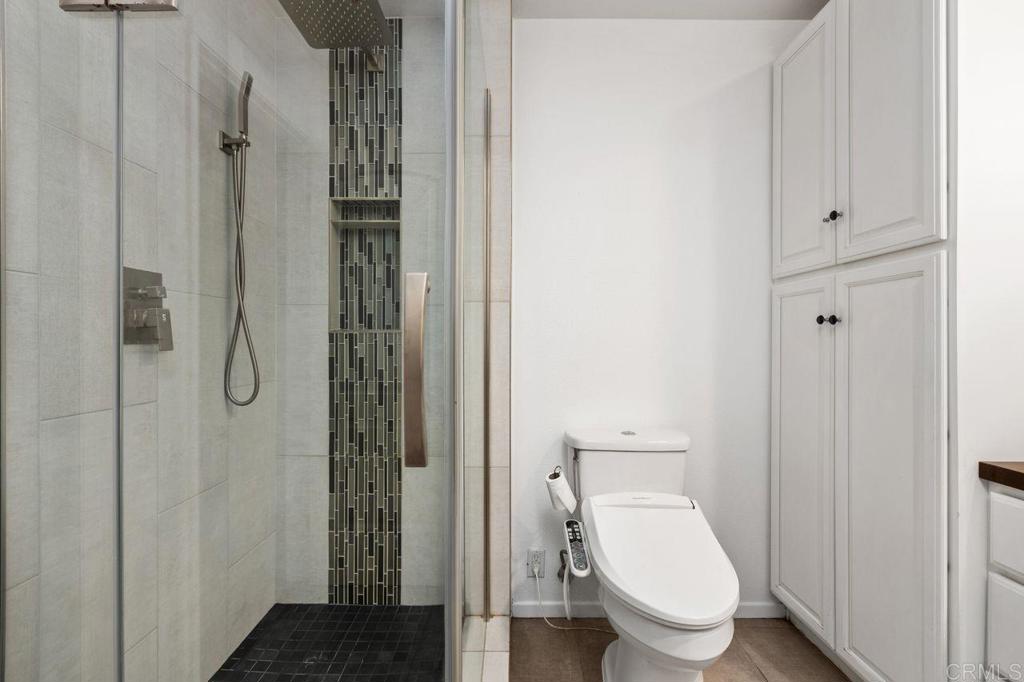 4369 Dowitcher Way Oceanside, CA 92057 - Photo 24 of 37 a bathroom with a toilet and a shower