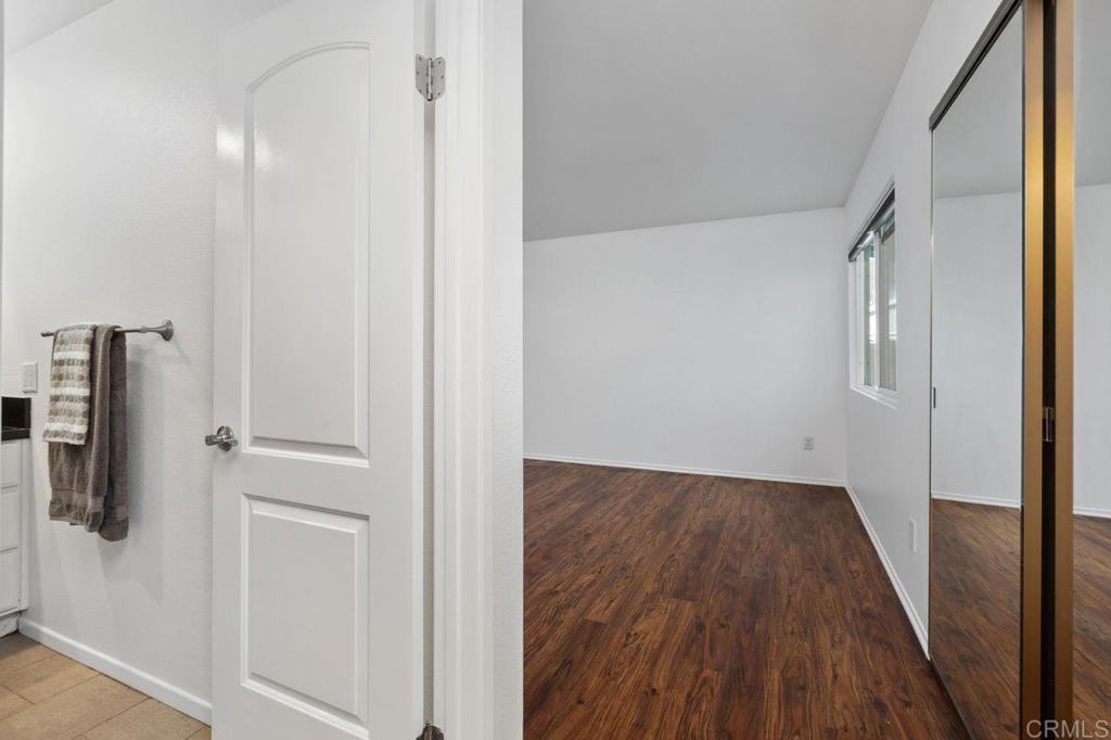 4369 Dowitcher Way Oceanside, CA 92057 - Photo 26 of 37 a view of a hallway with wooden floor and staircase