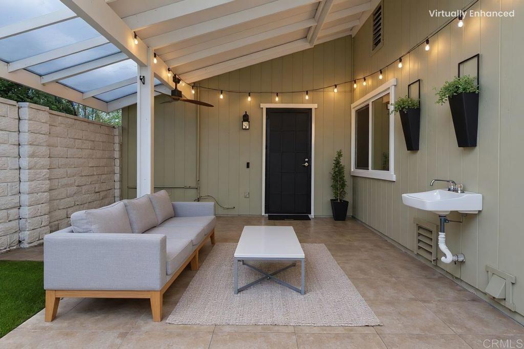 4369 Dowitcher Way Oceanside, CA 92057 - Photo 27 of 37 a living room with furniture and a rug