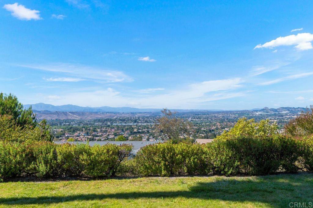 4369 Dowitcher Way Oceanside, CA 92057 - Photo 36 of 37 a view of a lake with houses in the back