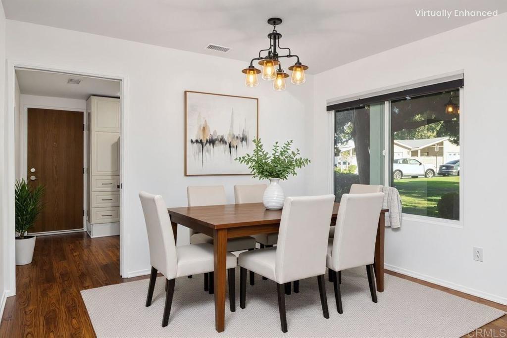 4369 Dowitcher Way Oceanside, CA 92057 - Photo 9 of 37 a view of a dining room with furniture window and wooden floor