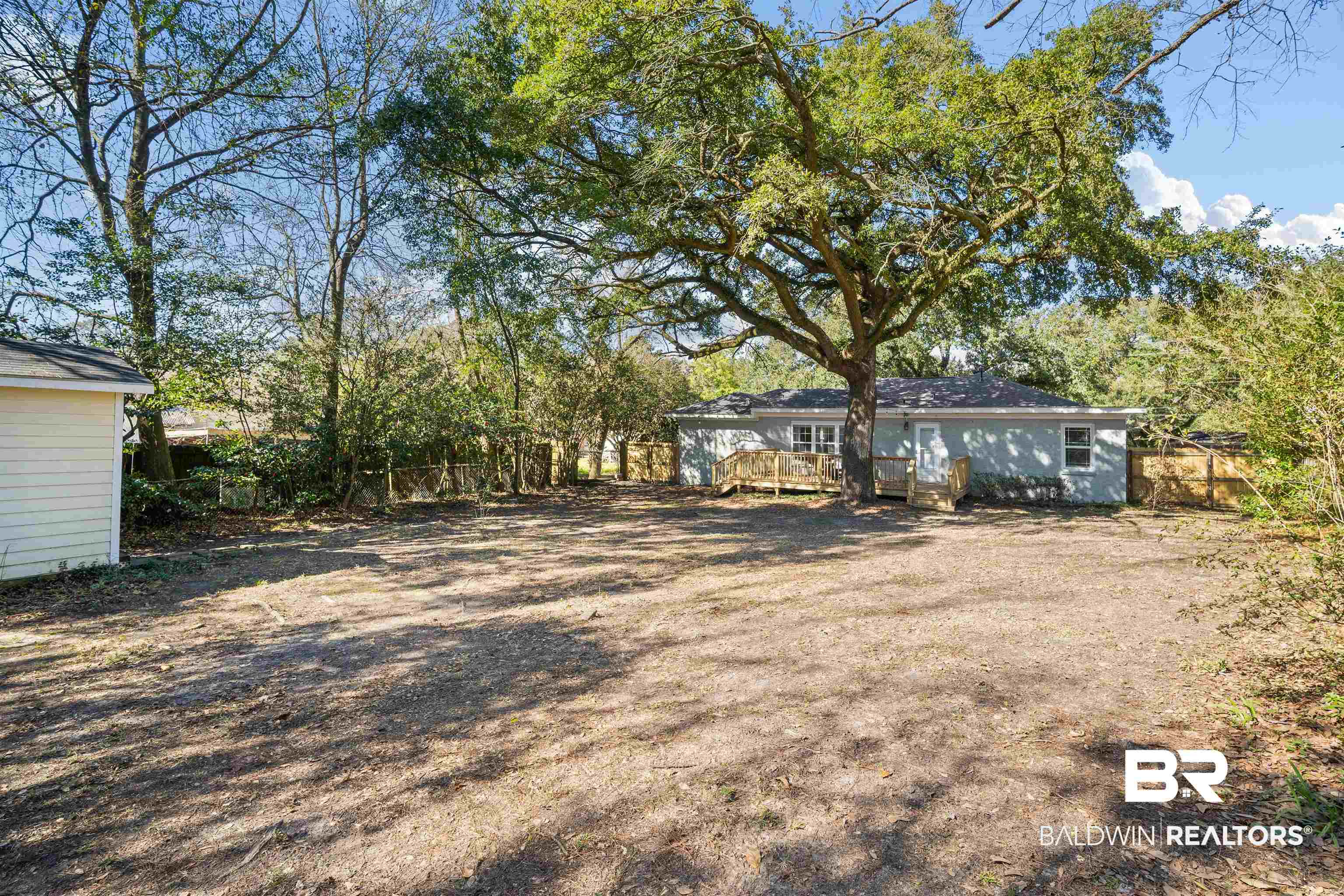 2615 Walton Avenue Mobile, AL 36606 - Photo 32 of 33 View of yard with fence and a wooden deck