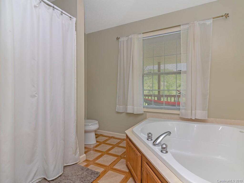 315 Garren Creek Road Rosman, NC 28772 - Photo 15 of 36 a bathroom with a tub and sink
