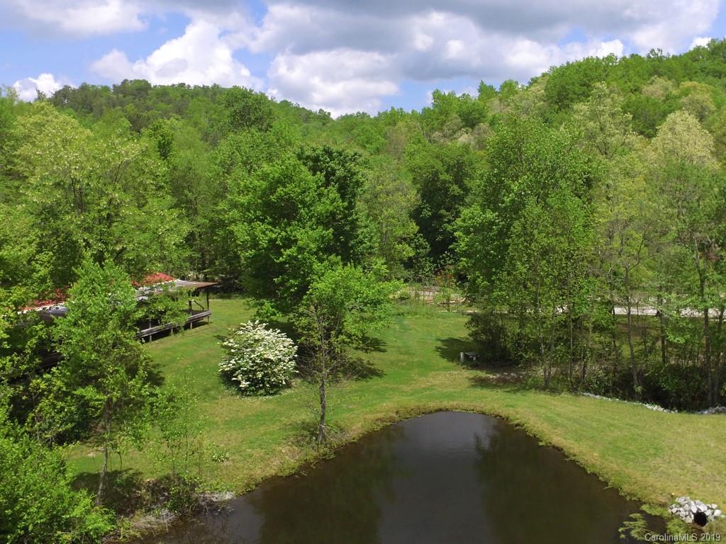 315 Garren Creek Road Rosman, NC 28772 - Photo 21 of 36 a view of a big yard with a house in the background