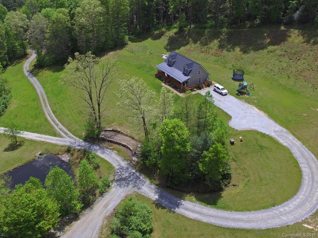 315 Garren Creek Road Rosman, NC 28772 - Photo 25 of 36 an aerial view of a house with outdoor space and a lake view