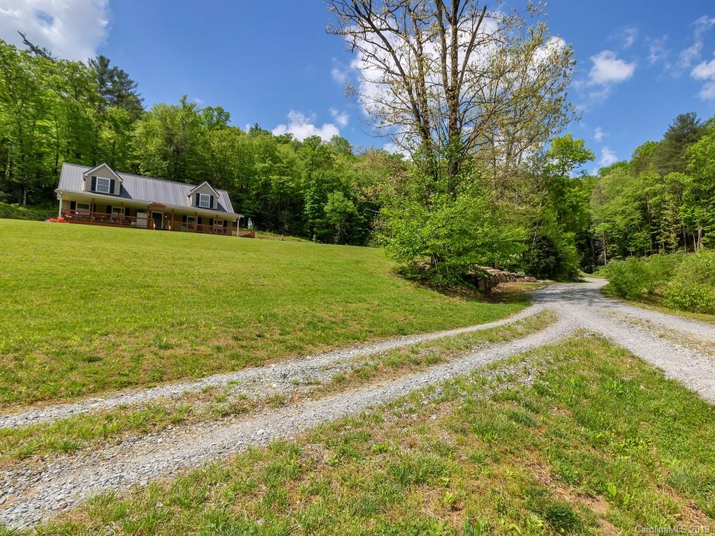 315 Garren Creek Road Rosman, NC 28772 - Photo 30 of 36 a view of a house with a yard