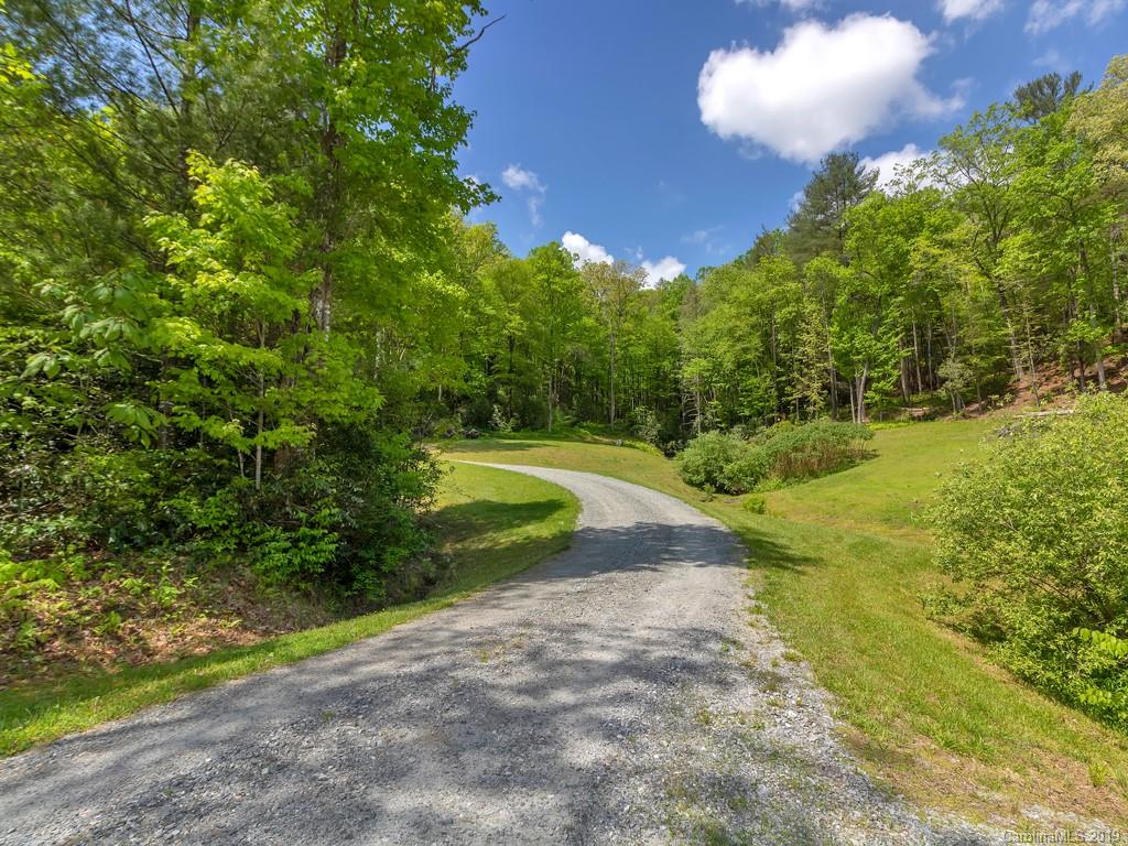 315 Garren Creek Road Rosman, NC 28772 - Photo 35 of 36 a view of a golf course with a yard
