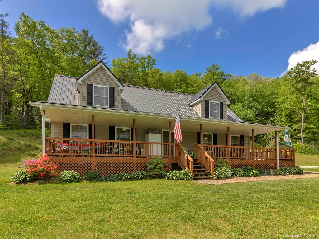 315 Garren Creek Road Rosman, NC 28772 - Photo 6 of 36 a front view of a house with a yard
