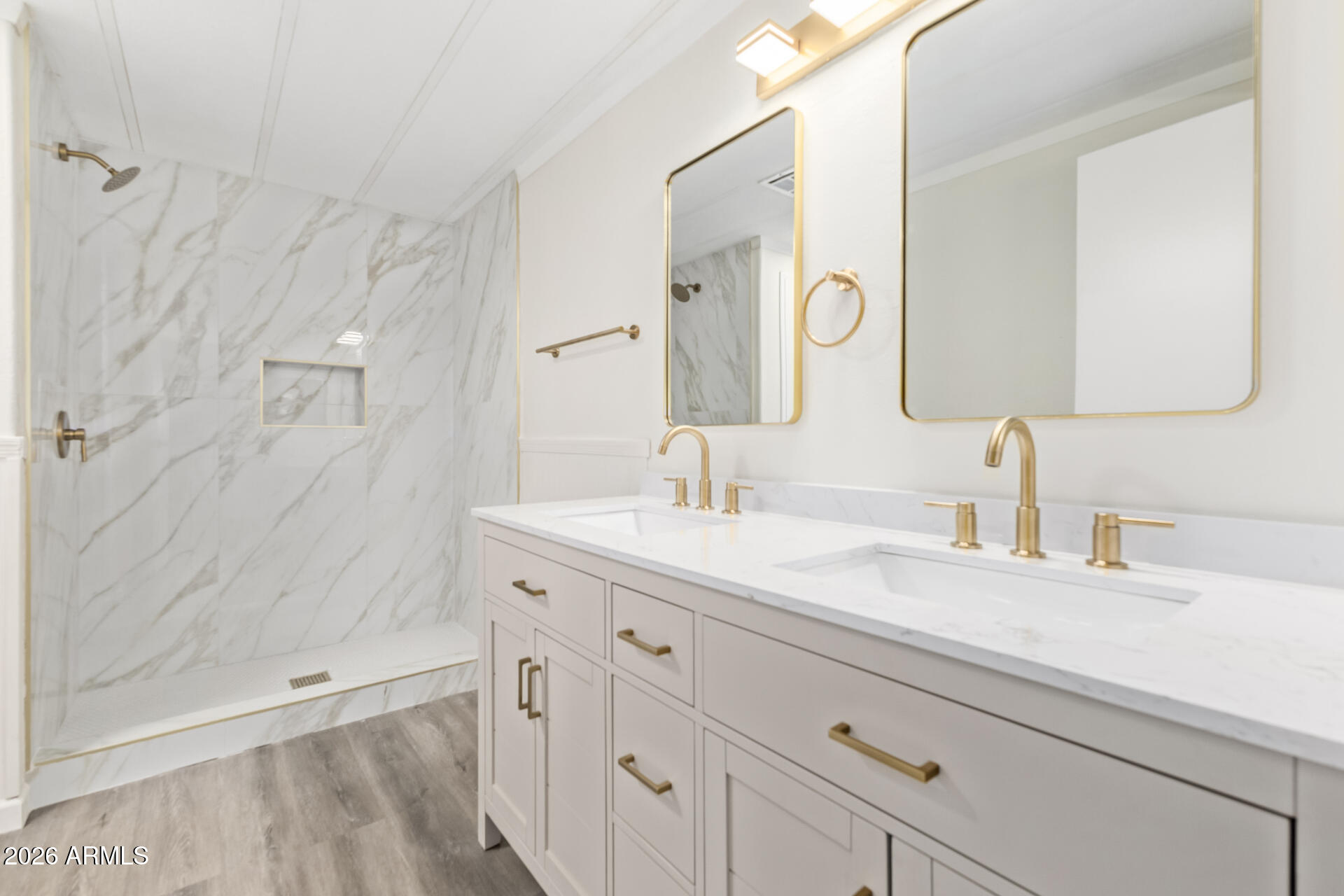 16216 North 35th Way Phoenix, AZ 85032 - Photo 11 of 17 a bathroom with a sink and a mirror