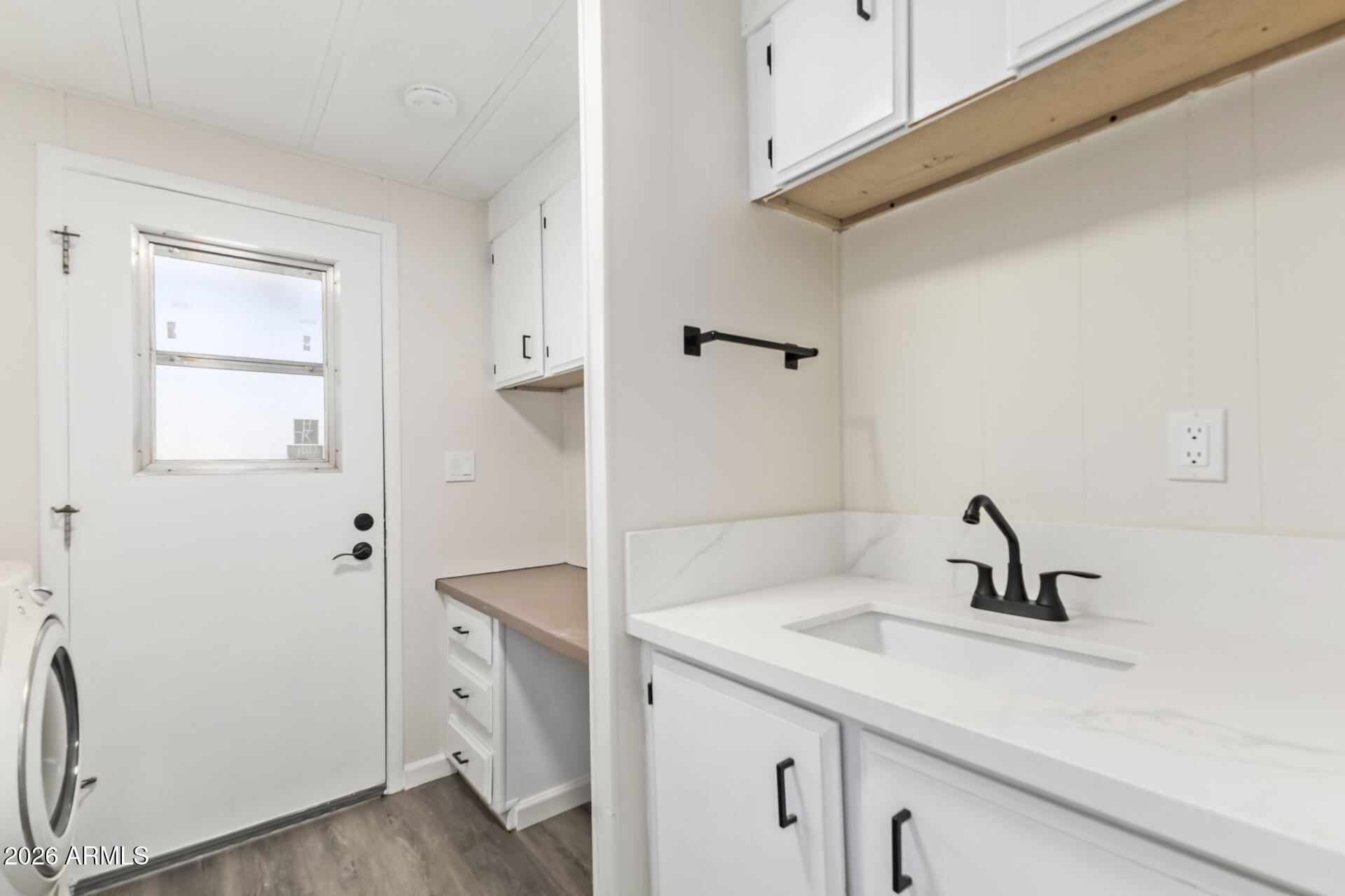 16216 North 35th Way Phoenix, AZ 85032 - Photo 16 of 17 a bathroom with a sink and a mirror