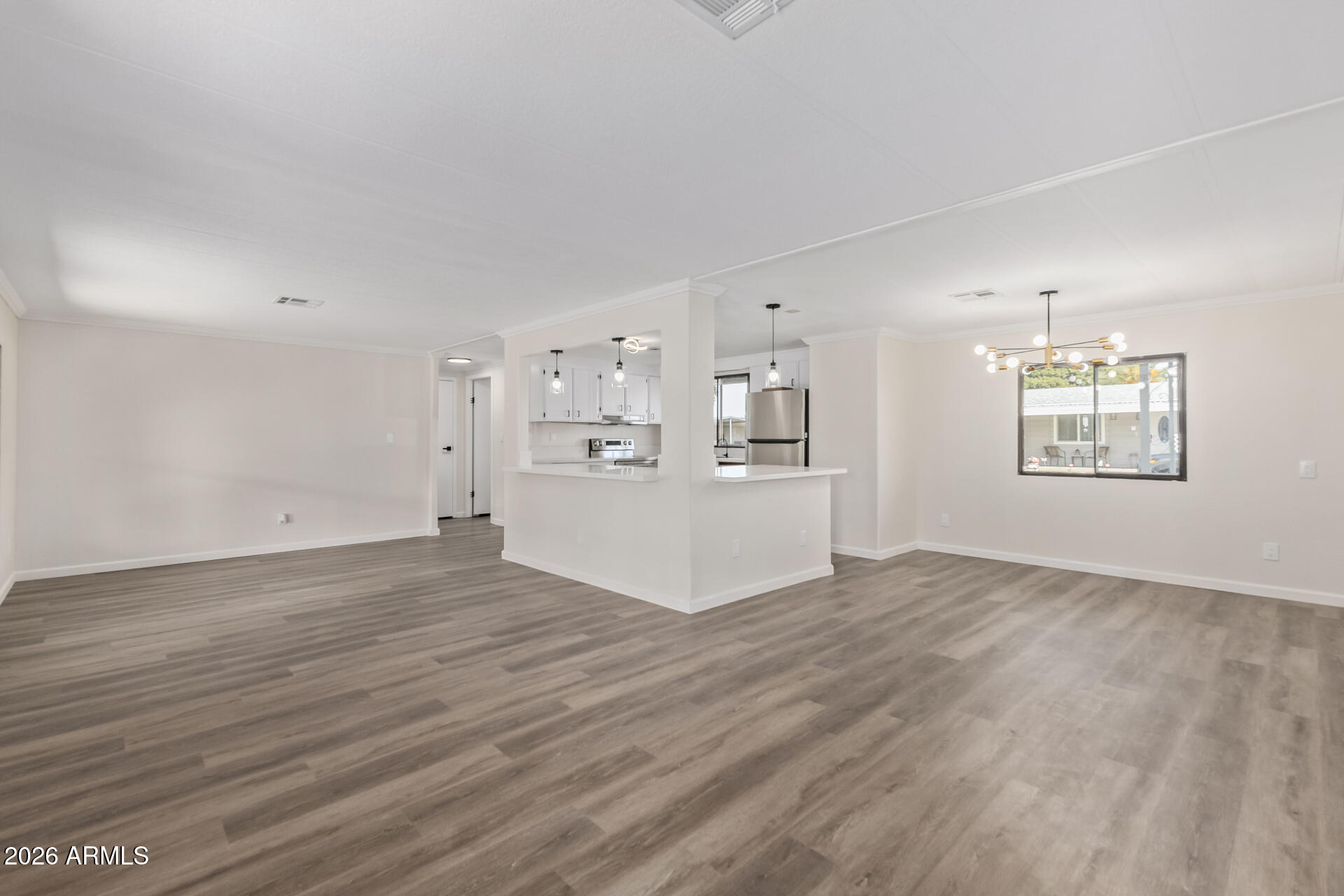 16216 North 35th Way Phoenix, AZ 85032 - Photo 3 of 17 a view of empty room with wooden floor