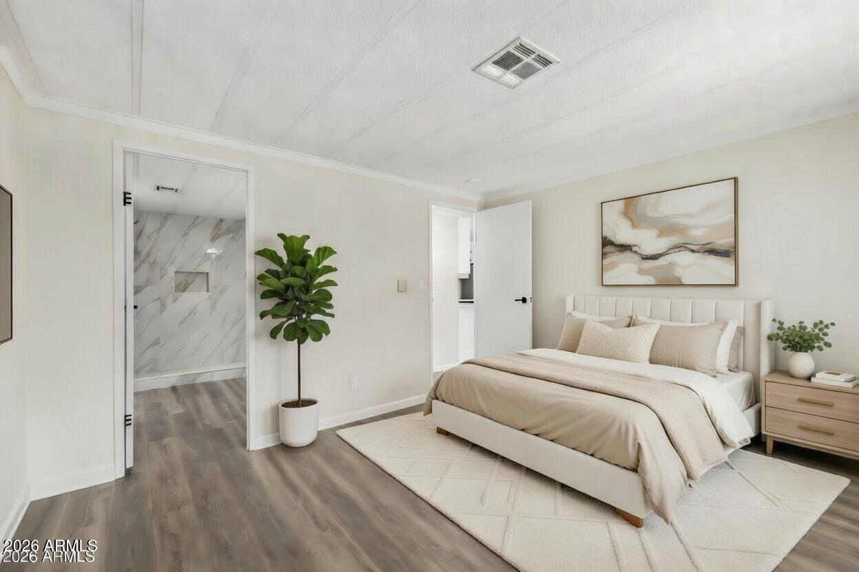 16216 North 35th Way Phoenix, AZ 85032 - Photo 10 of 17 a bedroom with a bed and a potted plant