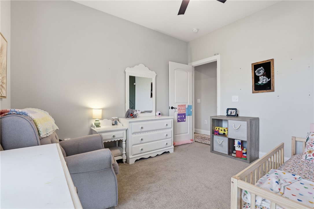 127 West Stewart Street Pelzer, SC 29669 - Photo 15 of 23 This cozy room offers a comfortable atmosphere, perfect for rest and relaxation.