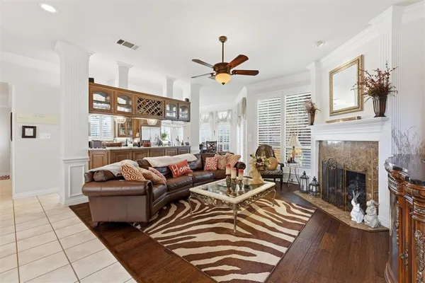 a living room with furniture fireplace and window