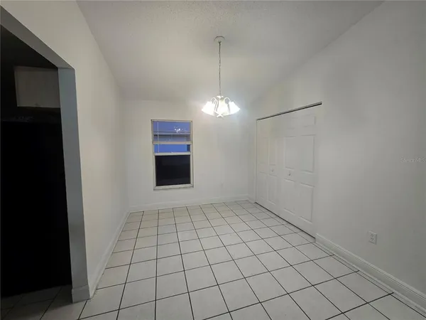 a view of an empty room and window