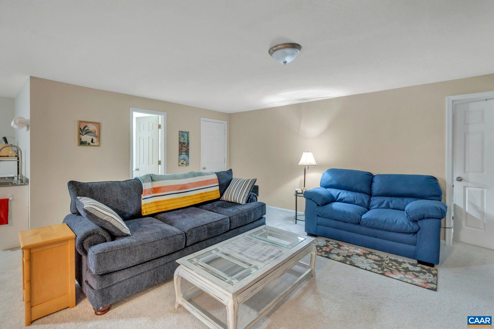 47 Dandelion Road Ruckersville, VA 22968 - Photo 20 of 35 a living room with furniture and a lamp
