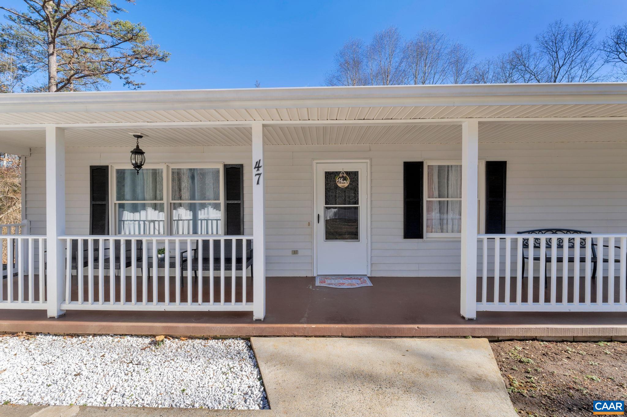 47 Dandelion Road Ruckersville, VA 22968 - Photo 3 of 35 a front view of a house with a porch
