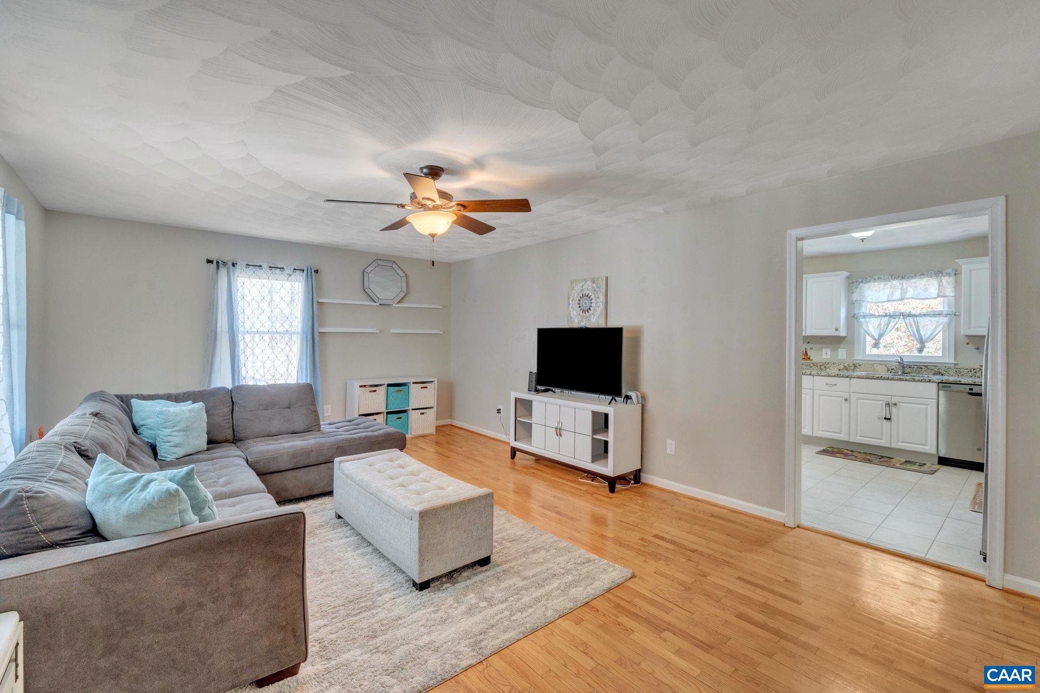 47 Dandelion Road Ruckersville, VA 22968 - Photo 7 of 35 a living room with furniture and a flat screen tv