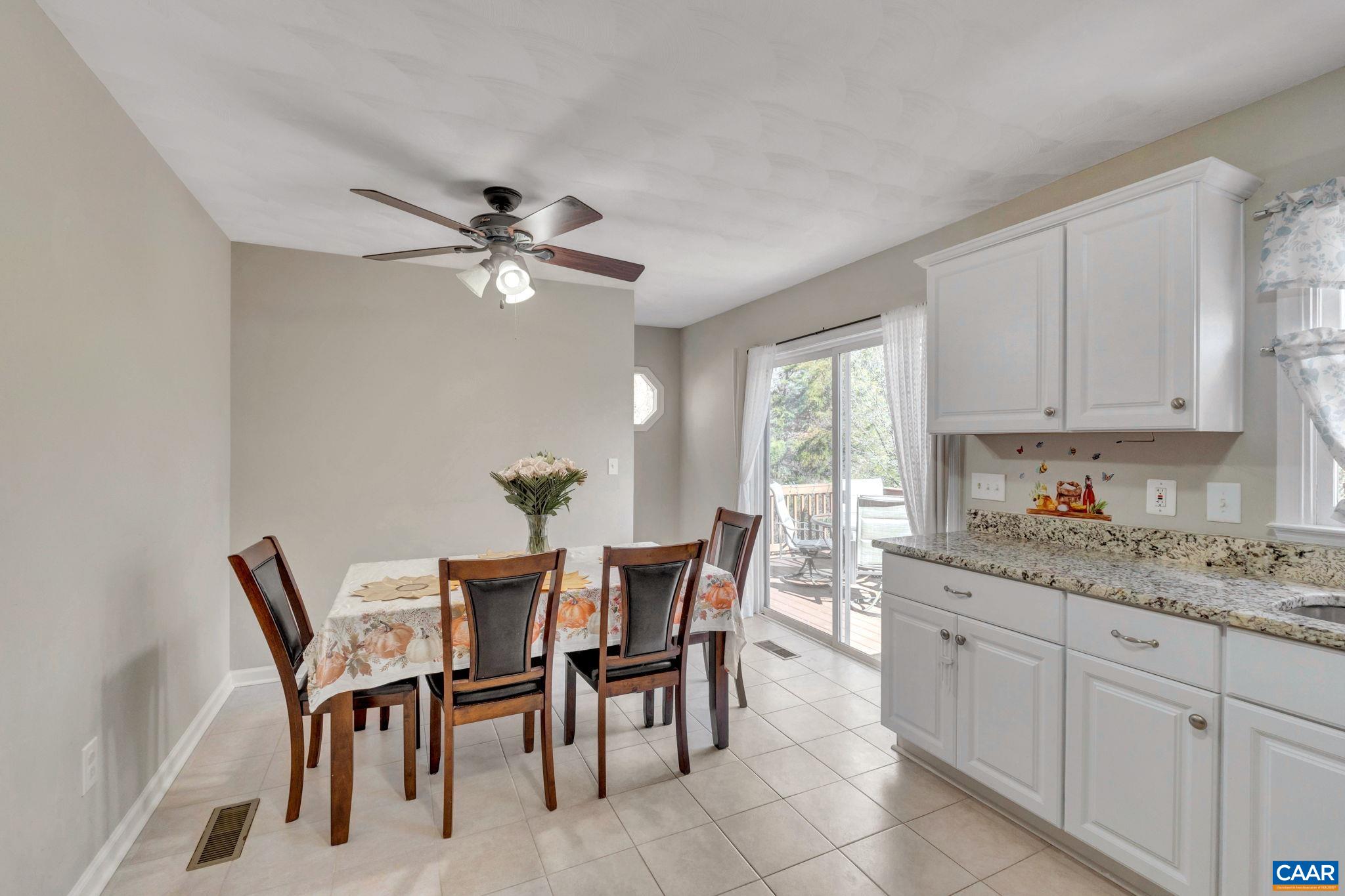 47 Dandelion Road Ruckersville, VA 22968 - Photo 10 of 35 a view of a dining room with furniture and a kitchen