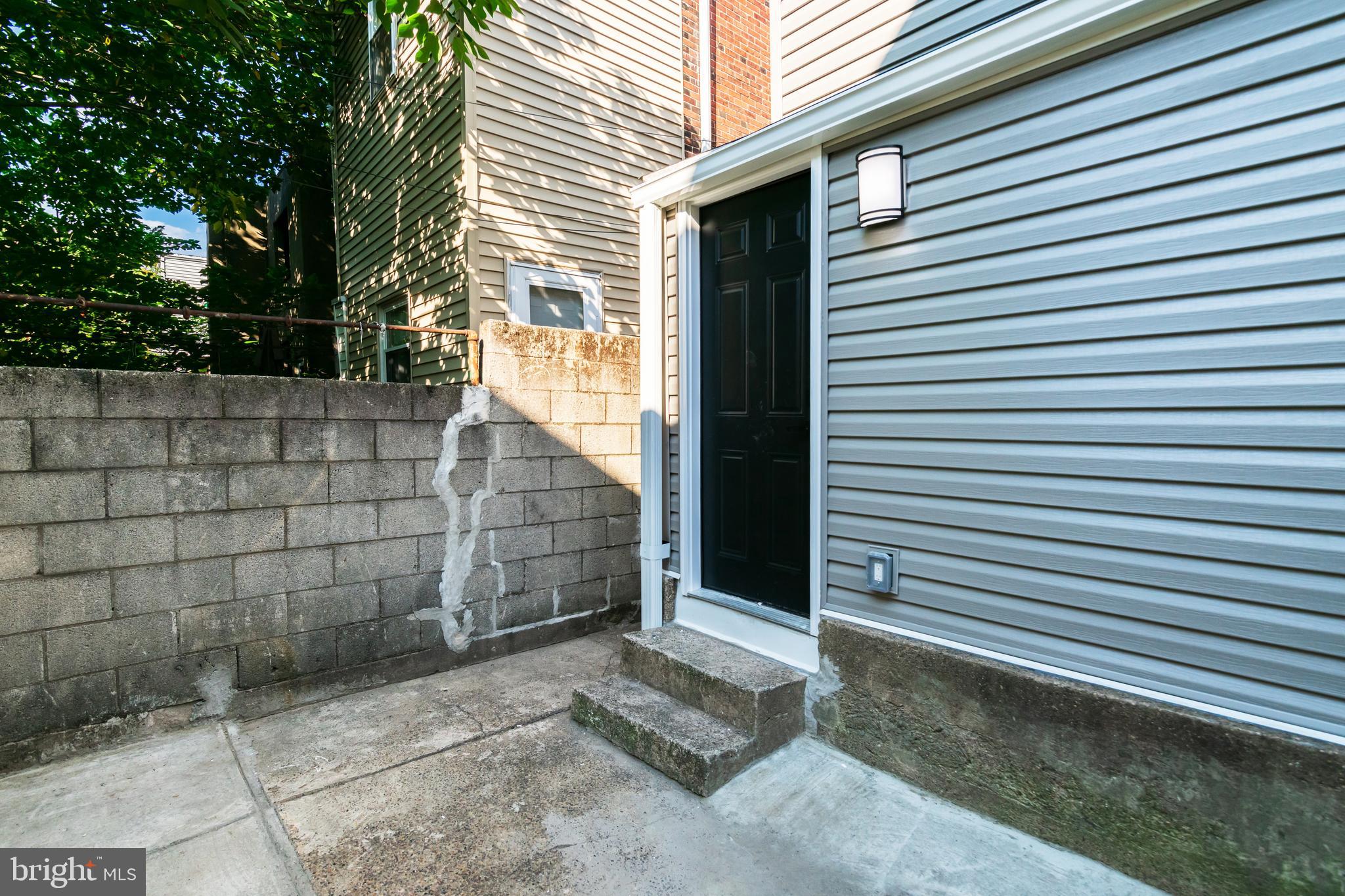 1844 South 23rd Street, Unit 1F Philadelphia, PA 19145 - Photo 16 of 21 a view of a back side of house and tree