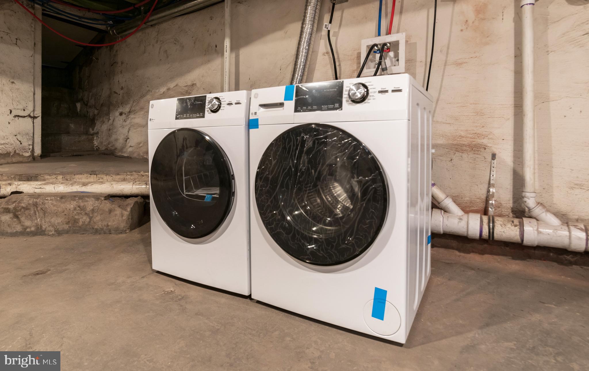 1844 South 23rd Street, Unit 1F Philadelphia, PA 19145 - Photo 17 of 21 a utility room with dryer and washer