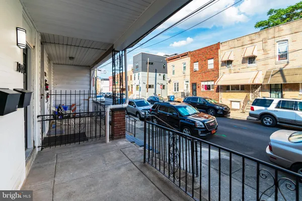 a outdoor view of a building with sitting area