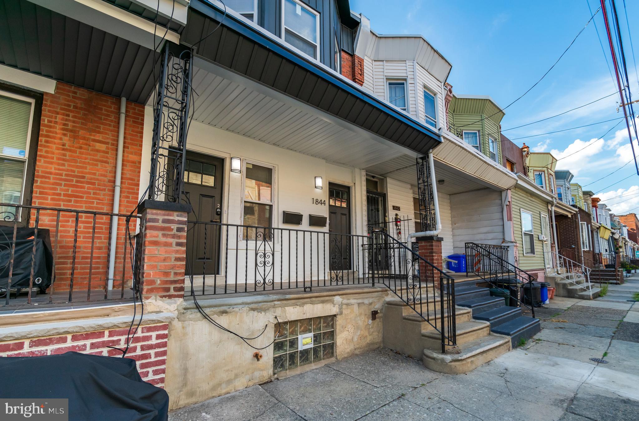 1844 South 23rd Street, Unit 1F Philadelphia, PA 19145 - Photo 20 of 21 a outdoor view of a building with sitting area