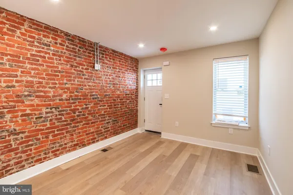 a view of an empty room and a window