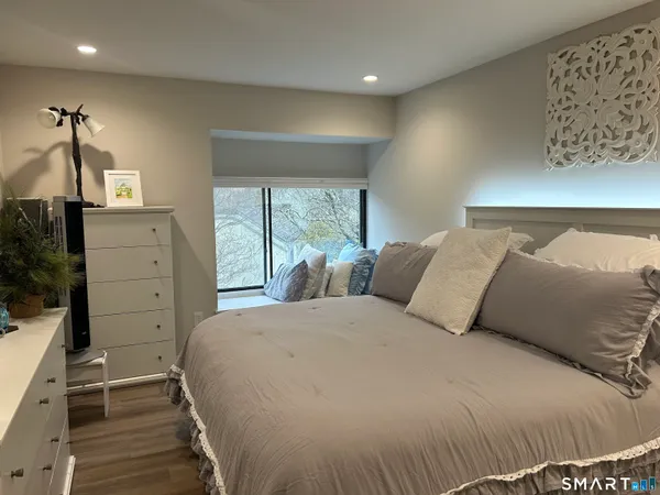 a bed room with a bed and a window