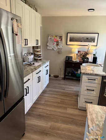 a kitchen with stainless steel appliances a stove and a refrigerator