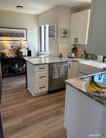 a view of a kitchen counter space and windows