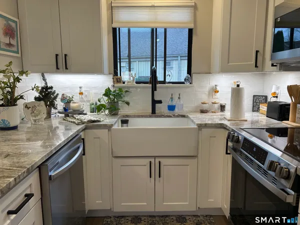 a kitchen with a sink and cabinets