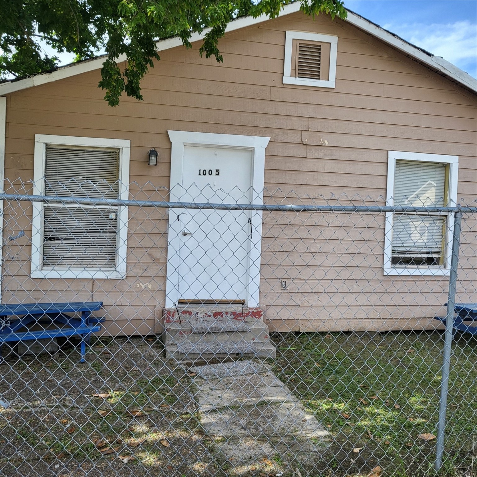 a view of brick house with a large window