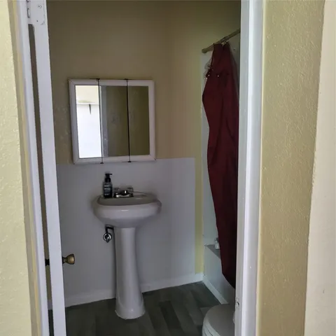 a bathroom with a sink and mirror