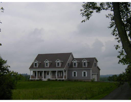 123 Town Farm Road Sutton, MA 01590 - Photo 1 of 1 a front view of a house with a garden