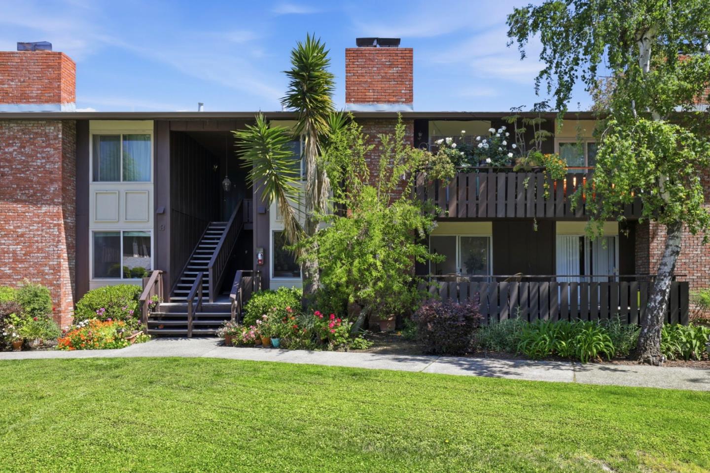 100 East Middlefield Road, Unit 3B Mountain View, CA 94043 - Photo 24 of 32 a front view of a house with a yard