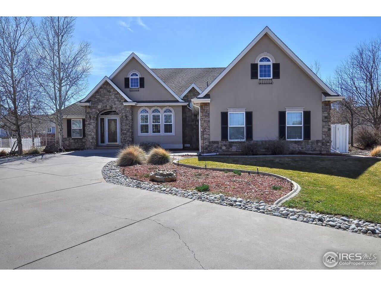 126 52nd Avenue Greeley, CO 80634 - Photo 1 of 24 a front view of a house with garden