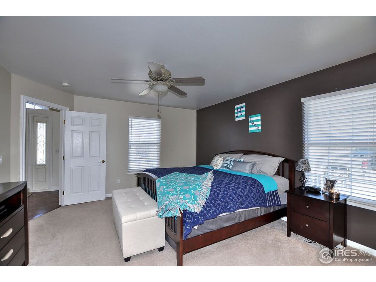 126 52nd Avenue Greeley, CO 80634 - Photo 11 of 24 a bedroom with a bed and window