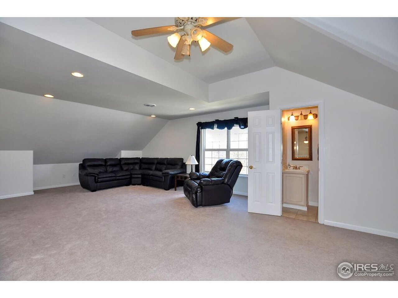 126 52nd Avenue Greeley, CO 80634 - Photo 16 of 24 a living room with furniture and chandelier
