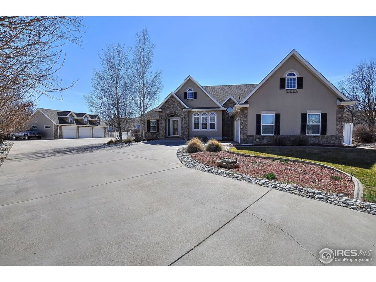 126 52nd Avenue Greeley, CO 80634 - Photo 2 of 24 a front view of a house with a yard