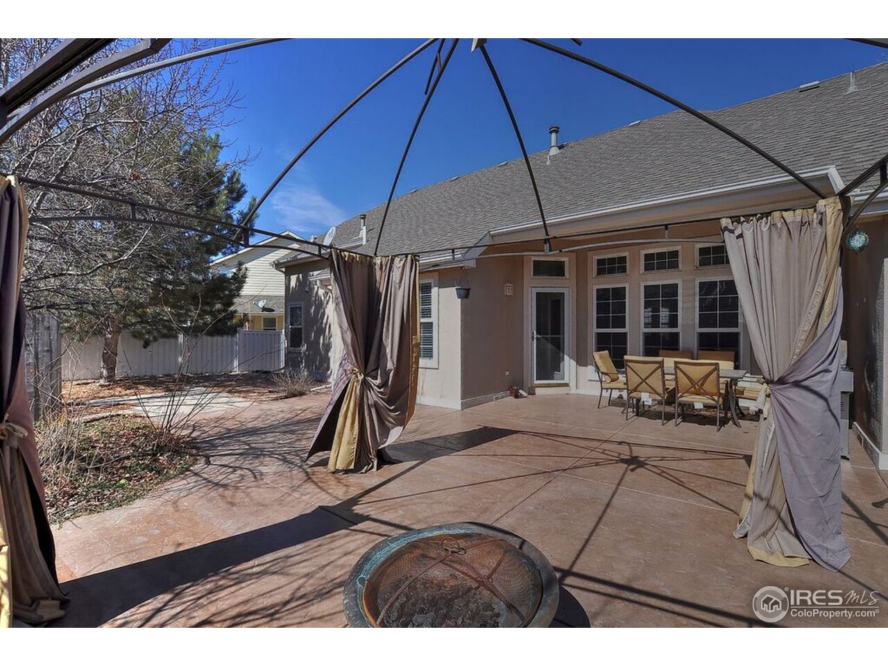 126 52nd Avenue Greeley, CO 80634 - Photo 21 of 24 a view of a backyard with a patio