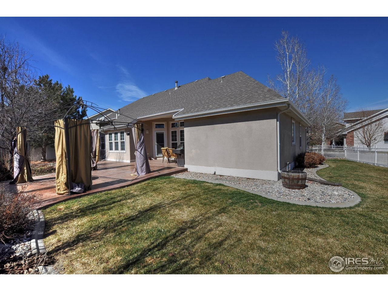 126 52nd Avenue Greeley, CO 80634 - Photo 23 of 24 a front view of a house with a yard