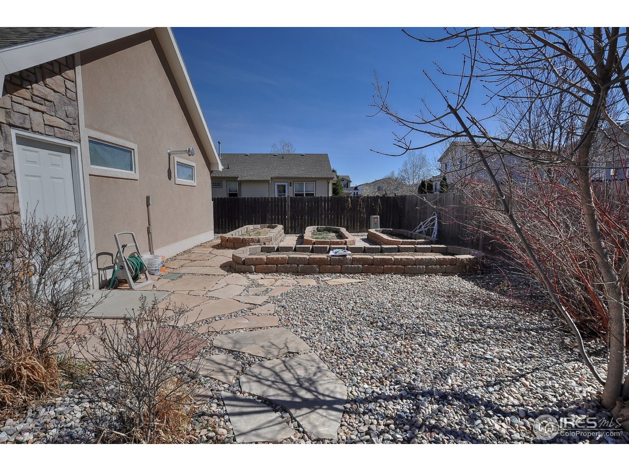 126 52nd Avenue Greeley, CO 80634 - Photo 24 of 24 a house view with a backyard space