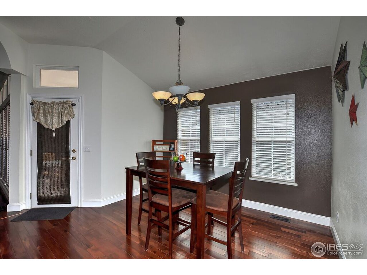 126 52nd Avenue Greeley, CO 80634 - Photo 8 of 24 a dining room with furniture and window